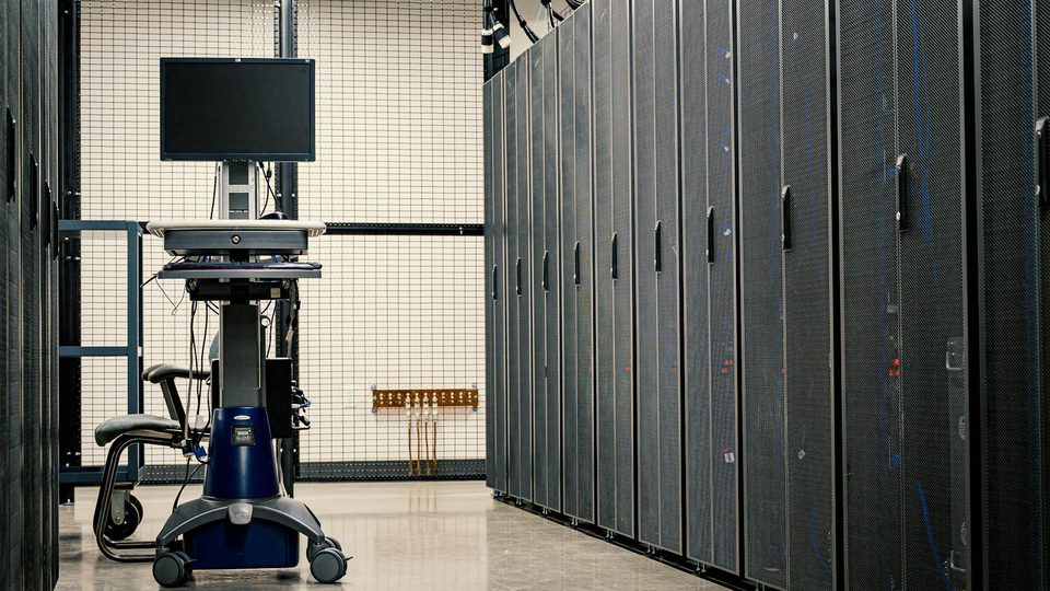 Rows of server hardware inside a data center.